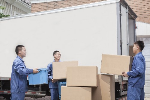 Professional movers handling a compact household relocation