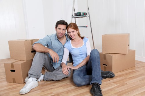 Loading boxes and furniture into a van for transport
